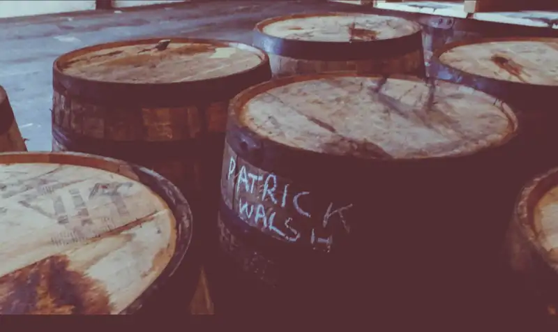 Cask heads chalked with the name Patrick Walsh